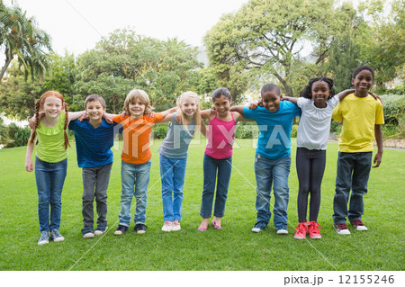 Cute pupils standing on the grass outside 12155246
