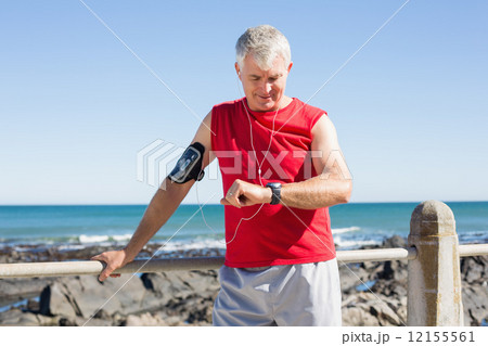 Fit mature man warming up on the pier Fit mature man warming up on the pier 12155561