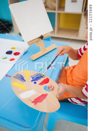 Cute little boy painting at table in classroom Cute little boy painting at table in classroom 12155689