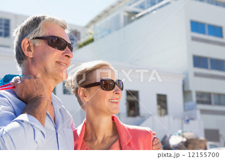 Happy senior couple holding shopping bags Happy senior couple holding shopping bags 12155700