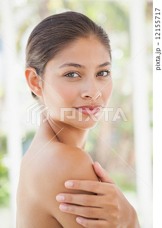 Beautiful brunette smiling at camera 12155717