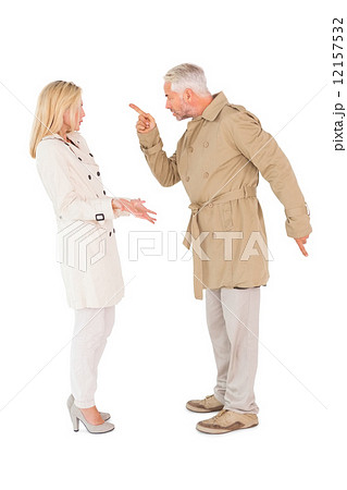 Angry couple fighting in trench coats 12157532