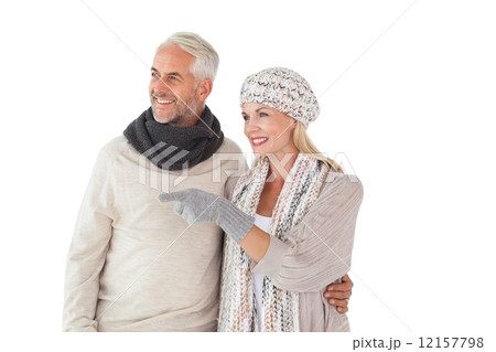Happy couple in winter fashion looking 12157798