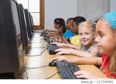 Cute pupils in computer class Cute pupils in computer class 12158400