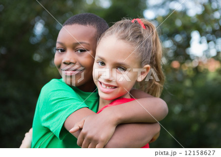 Cute children smiling at camera outside 12158627