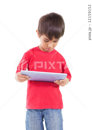 Cute little boy using tablet pc 12159152