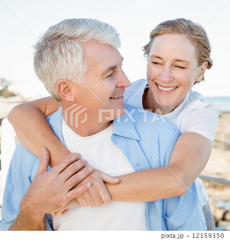 Casual couple having fun by the sea Casual couple having fun by the sea 12159350