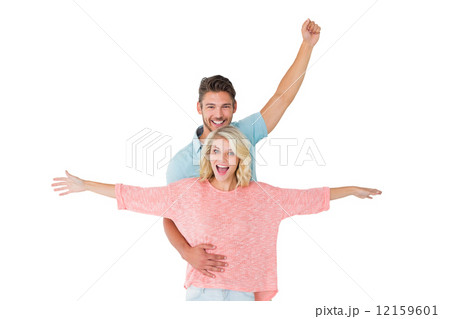 Attractive couple smiling and cheering 12159601