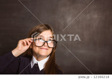 Cute pupil smiling and looking up 12160218