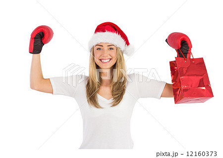 Festive blonde punching with boxing gloves 12160373