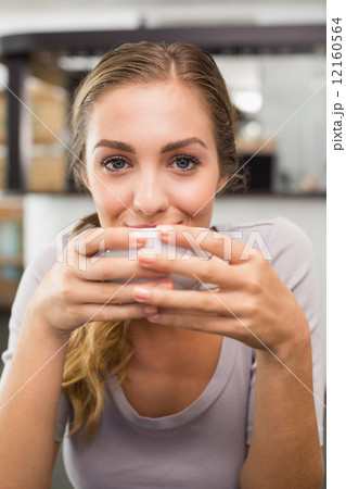 Pretty blonde enjoying a coffee 12160564