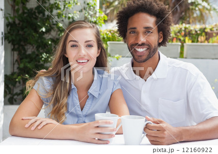 Happy couple having coffee together Happy couple having coffee together 12160922