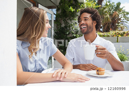 Happy couple having coffee together 12160996
