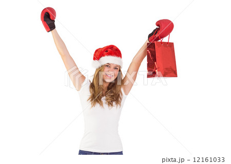Festive blonde with boxing gloves and shopping bag 12161033