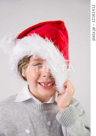 Child wearing a santa hat Child wearing a santa hat 12161412