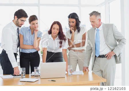 Business team discussing work details 12162103