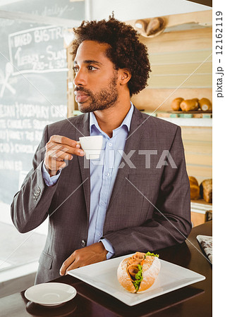 Businessman enjoying his lunch hour Businessman enjoying his lunch hour 12162119