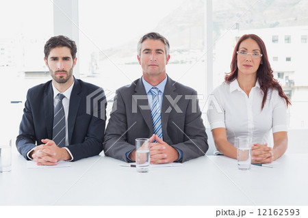 Serious business people sitting together 12162593