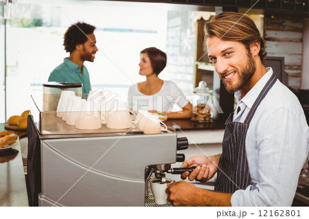Barista making a cup of coffee 12162801