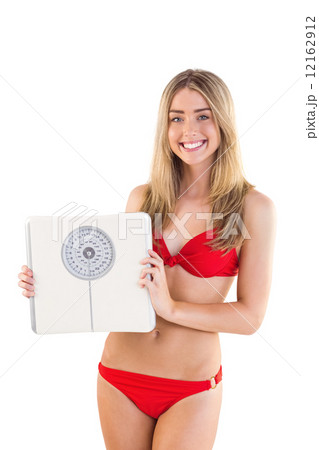 Fit blonde in red bikini showing scales 12162912