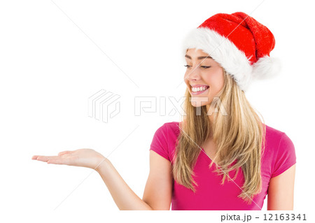 Festive blonde presenting with hand Festive blonde presenting with hand 12163341