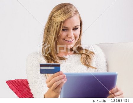 Pretty blonde shopping online with tablet pc Pretty blonde shopping online with tablet pc 12163435