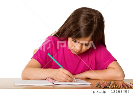 Cute pupil working at her desk Cute pupil working at her desk 12163495