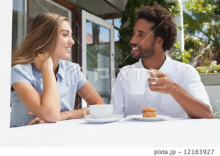 Happy couple having coffee together Happy couple having coffee together 12163927