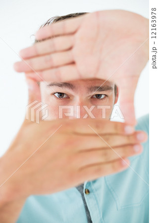 Young man making frame with his hands Young man making frame with his hands 12163978
