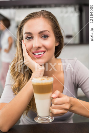 Pretty blonde enjoying a latte Pretty blonde enjoying a latte 12164009