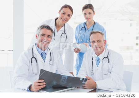 Doctor holding up an x-ray 12164220