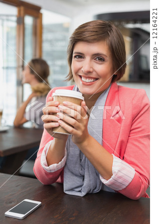 Pretty brunette enjoying her coffee Pretty brunette enjoying her coffee 12164221