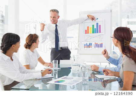 Business man giving a presentation Business man giving a presentation 12164390