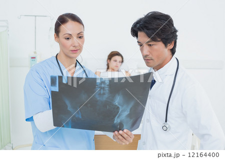 Nurse and doctor with x-ray Nurse and doctor with x-ray 12164400