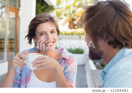 Happy couple enjoying coffee together Happy couple enjoying coffee together 12164481