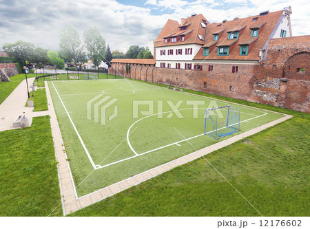 Football field in an old part of city. 12176602