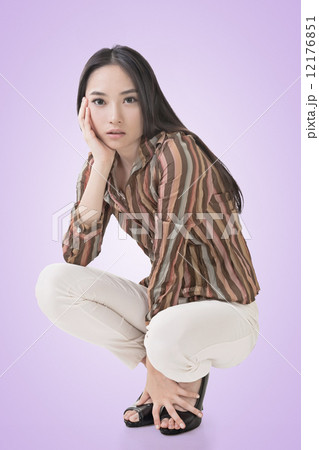 Squat pose by sexy Asian beauty Squat pose by sexy Asian beauty 12176851