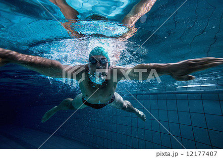 Fit swimmer training by himself 12177407