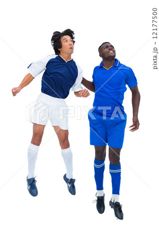 Football players tackling for the ball Football players tackling for the ball 12177500