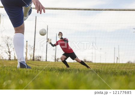 Goalkeeper in red saving a penalty 12177685