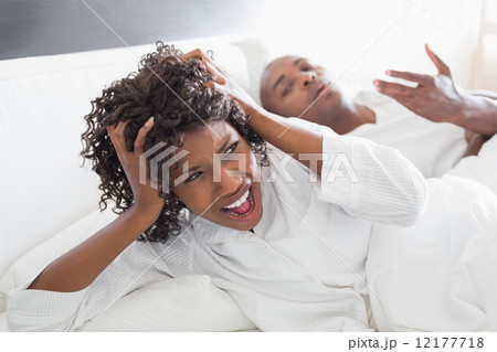 Young couple arguing in bed Young couple arguing in bed 12177718
