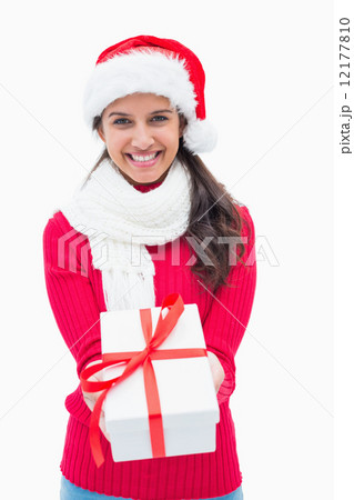 Beautiful festive woman offering gift Beautiful festive woman offering gift 12177810