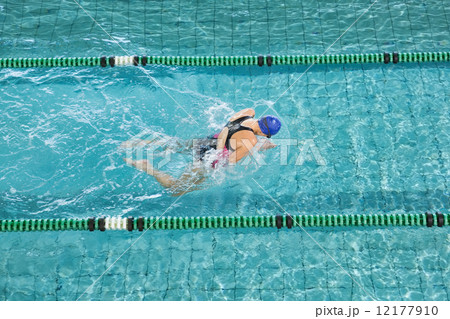 Fit swimmer training by herself Fit swimmer training by herself 12177910
