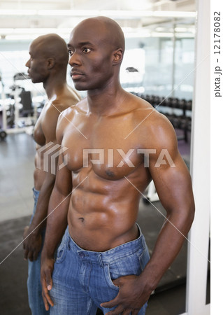 Muscular man with reflection looking away Muscular man with reflection looking away 12178082