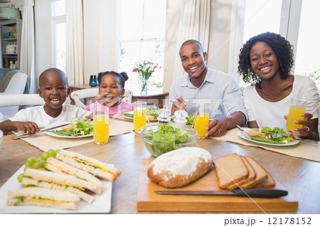 Happy family enjoying a healthy meal together 12178152