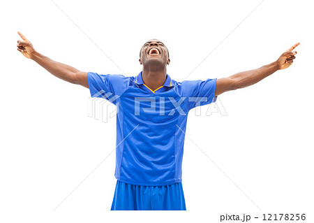 Excited football player in blue cheering 12178256