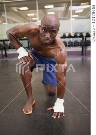 Shirtless muscular man at gym Shirtless muscular man at gym 12178668