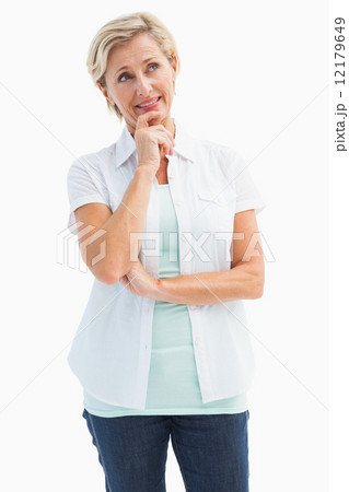 Happy mature blonde thinking with hand on chin Happy mature blonde thinking with hand on chin 12179649