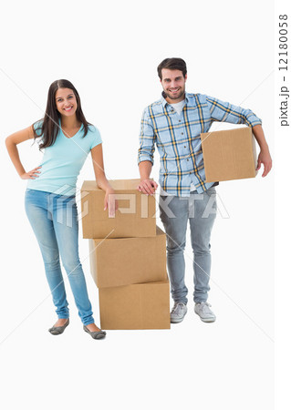 Attractive young couple with moving boxes 12180058