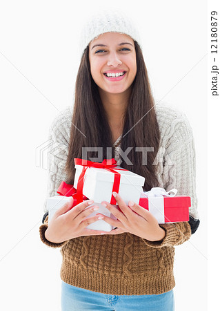 Pretty brunette holding many presents Pretty brunette holding many presents 12180879